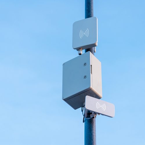 Light and wireless network on the pole with blue sky background.Telecommunications equpiment on a pole.Copy space.